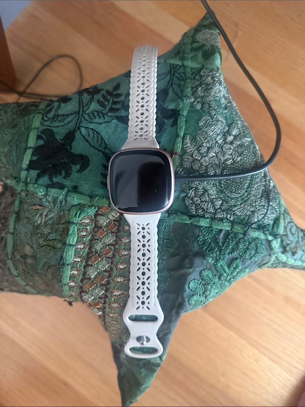 fitbit White Smartwatch with Rose Gold Case and Perforated Silicone Band